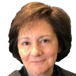 A middle-aged woman with short brown hair and a slight smile, photographed against a white background.